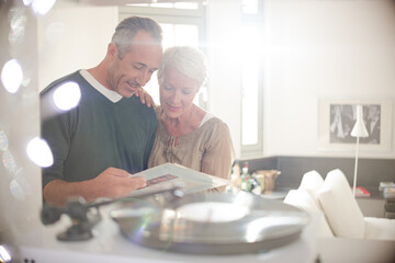 Older couple listening to vinyl records