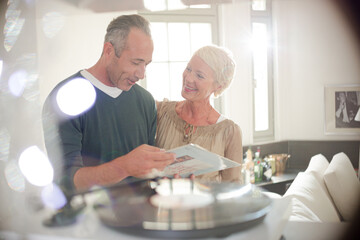 Older couple listening to vinyl records