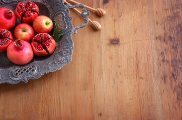 Rosh hashanah (jewish New Year holiday) concept. Pomegranate and apple raditional symbols