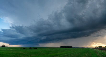 ThunderStorm over fields, a huge storm cloud that causes heavy rainfall