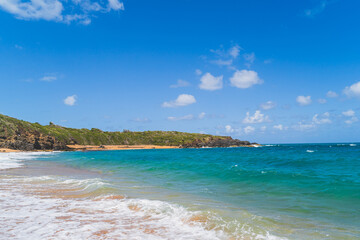 Panoramic view of tropical Red sand beach and blue water against sky