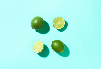 Tasty limes on color background