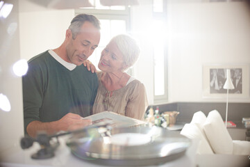 Older couple listening to vinyl records