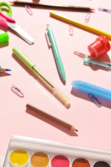 Stationery supplies on color background