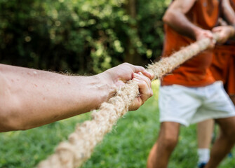 Mature people in tug of war - obrazy, fototapety, plakaty