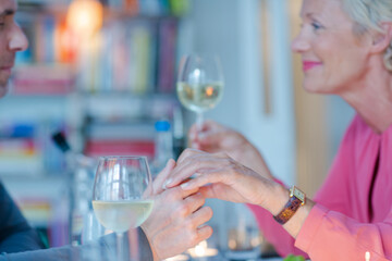 Close up of romantic older couple holding hands