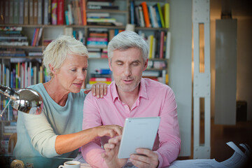 Business people using digital tablet in home office