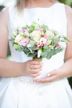beautiful wedding bouquet in the hands of the bride. High quality photo