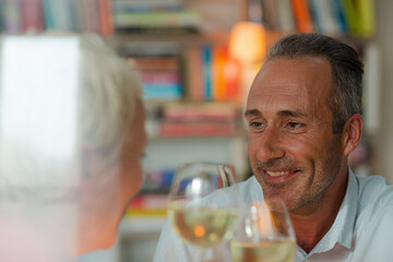 Older man smiling at wife