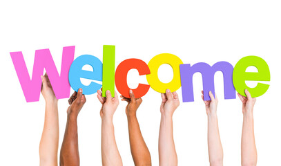 Multi-Ethnic Group Of People Holding The Word Welcome - Powered by Adobe