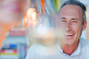 Older man smiling at wife