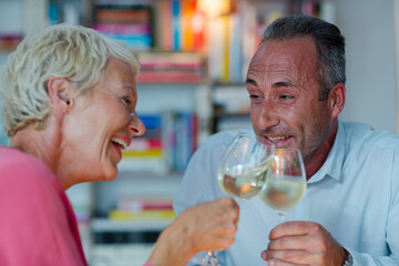 Older friends drinking white wine