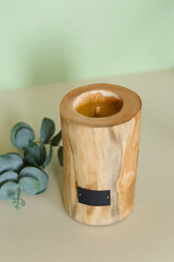 Wooden candle holder rustic interior centerpiece with candles in a cozy barn setting.