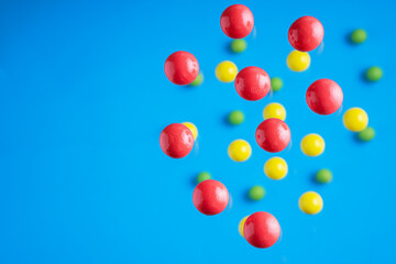 Colorful balls flowing upwards on blue background. .Abstract background with bright balls.