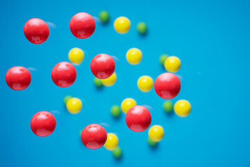 Fototapeta na wymiar Colorful balls flowing upwards on blue background. .Abstract background with bright balls.