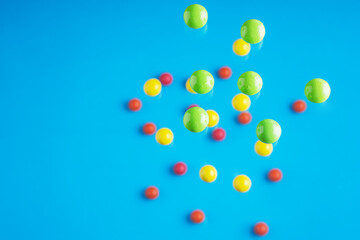 Colorful balls flowing upwards on blue background. .Abstract background with bright balls.