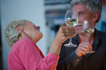 Older friends drinking wine