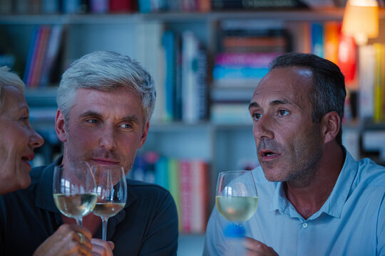 Older Friends Tasting White Wine