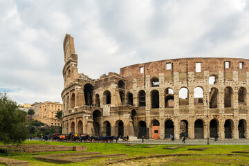Obraz premium Colosseum, also known as the Flavian Amphitheater, commissioned in A.D. 70-72 by Emperor Vespasian, is the largest amphitheater ever built, made of concrete and sand., Rome, Italy