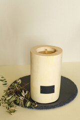 Wooden candle holder rustic interior centerpiece with candles in a cozy barn setting.