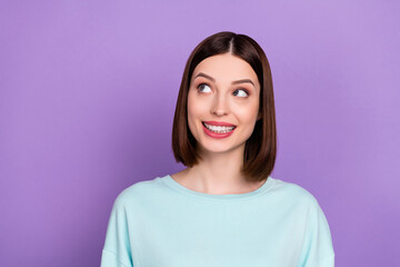 Fototapeta premium Photo portrait smiling girl wearing blue sweatshirt looking blank space isolated pastel violet color background
