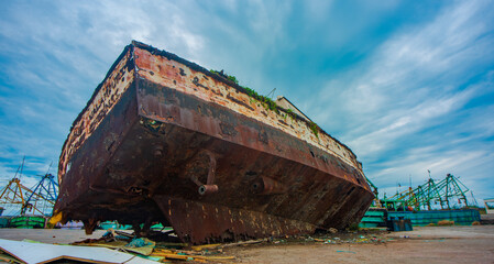 old abounded boat in the land.
