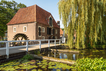 Watermill and lock in the small and picturesque village of Borculo in the Achterhoek, Netherlands. - obrazy, fototapety, plakaty