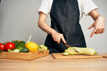 woman in apron cooking housewife in the kitchen