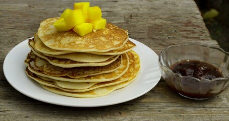 Breakfast: pancakes, fruit and jam . Delicious breakfast