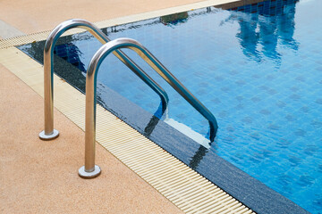 stainless steel ladder and swimming pool