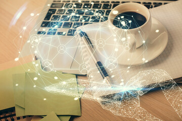 Double exposure of social network drawing and desktop with coffee and items on table background. Concept of international connection.