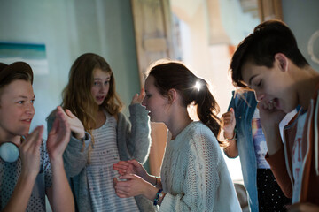 Obraz premium Group of teenagers dancing in living room