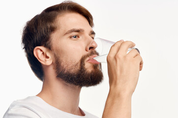 man in white t-shirt glass of water isolated background