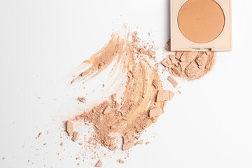 Set with Crushed beige face finishing and bronzing powder  isolated on white background. Make up background