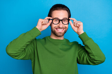 Photo of smiling cool intelligent smart guy wear spectacles bad vision eyesight geek isolated on...