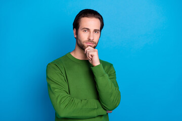 Photo of young cool confident serious businessman thinking brainstorming wear green jumper isolated...