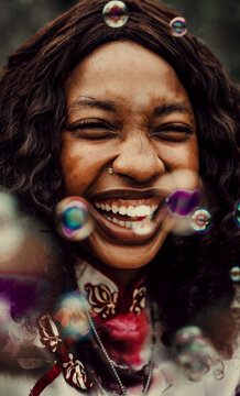 Close-up of laughing woman with soap bubbles