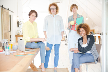 Group of smiling women at work