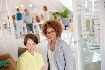 Obraz premium Portrait of two smiling office workers
