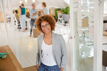Portrait of young woman smiling at office