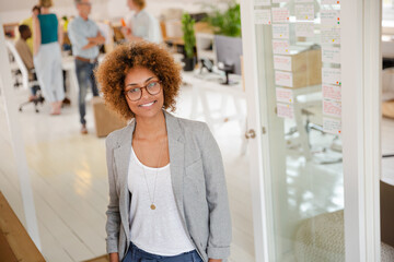 Portrait of young woman smiling at office