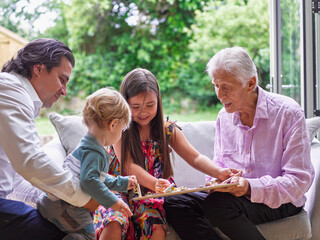 Multi generational family playing at home