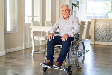 Happy senior as a patient in a wheelchair after stroke