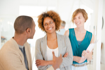 Fototapeta premium Portrait of talking and smiling office workers