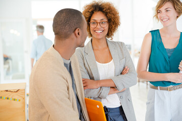 Obraz premium Portrait of talking and smiling office workers