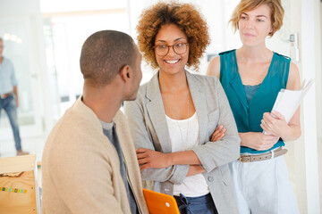 Obraz premium Portrait of talking and smiling office workers