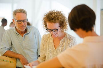 Office workers talking and smiling