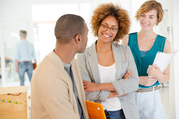 Portrait of talking and smiling office workers