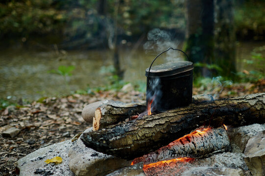 Cooking in a pot over campfire