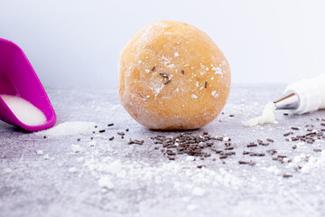 icing sugar donuts with chocolate sprinkles on top